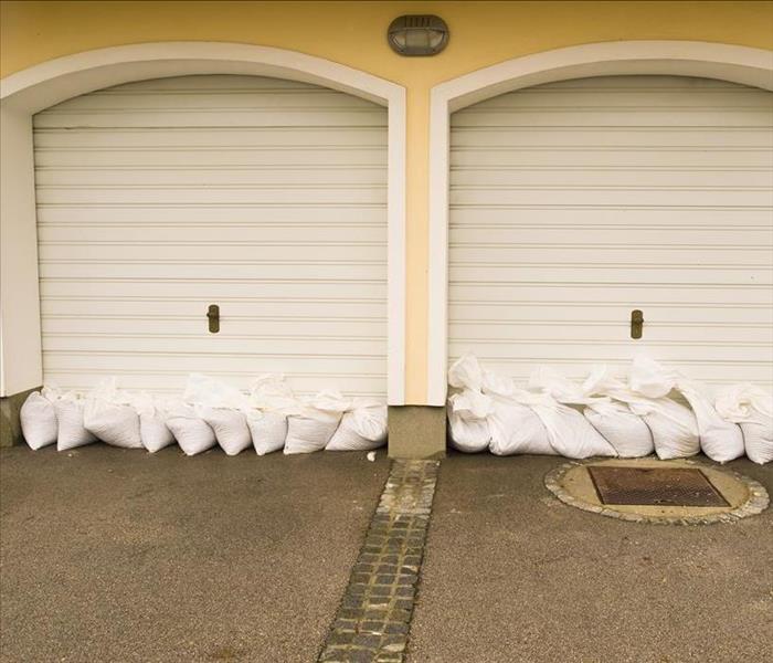 sandbags stacked to prevent flooding at garage doors 