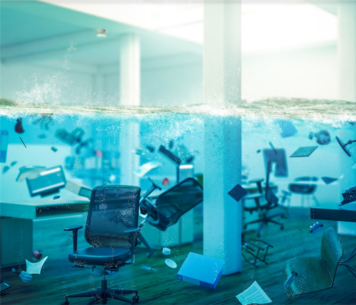 a flooded office with furniture floating around everywhere